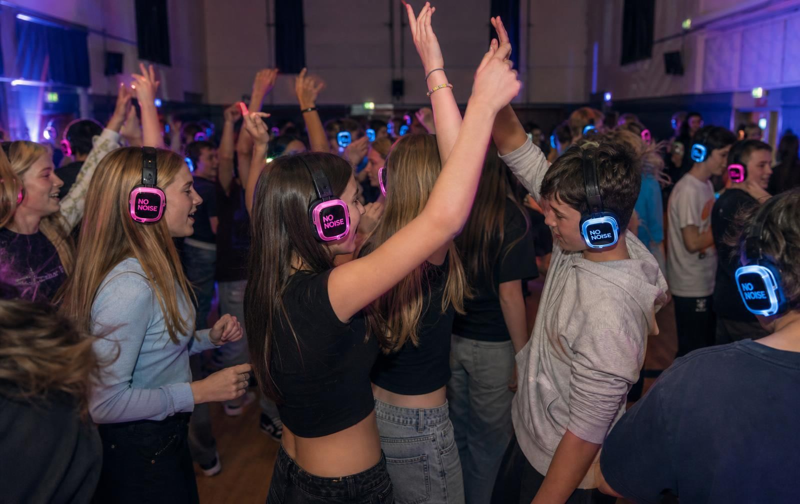 School and college silent disco hire in Devon — students dancing with LED headphones